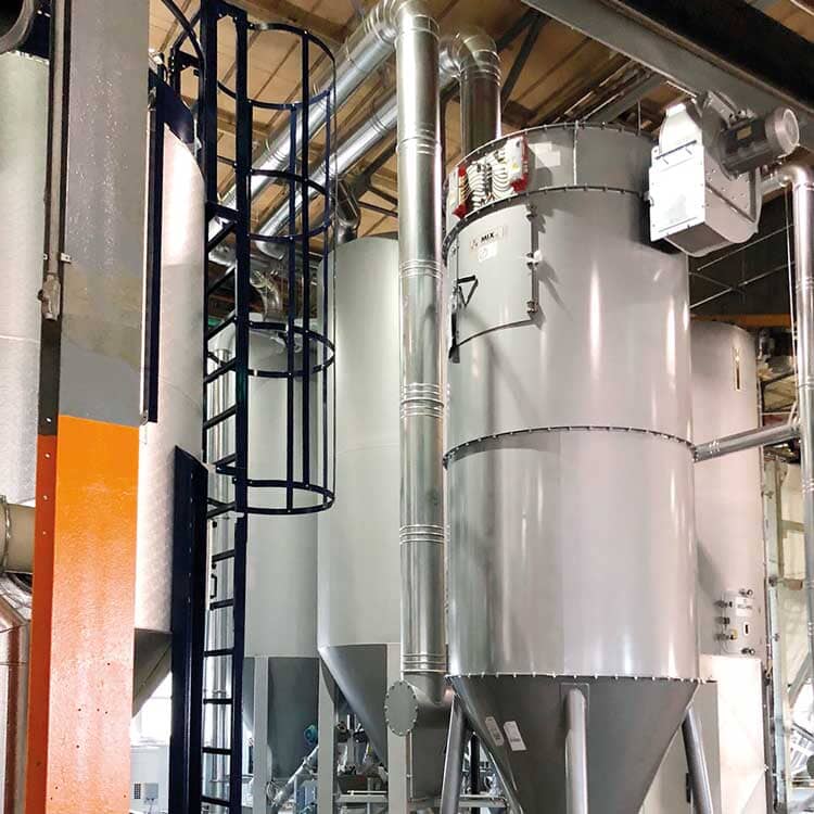 Industrial silo dust filters equipped with fans for efficient air quality control in UK & Ireland.